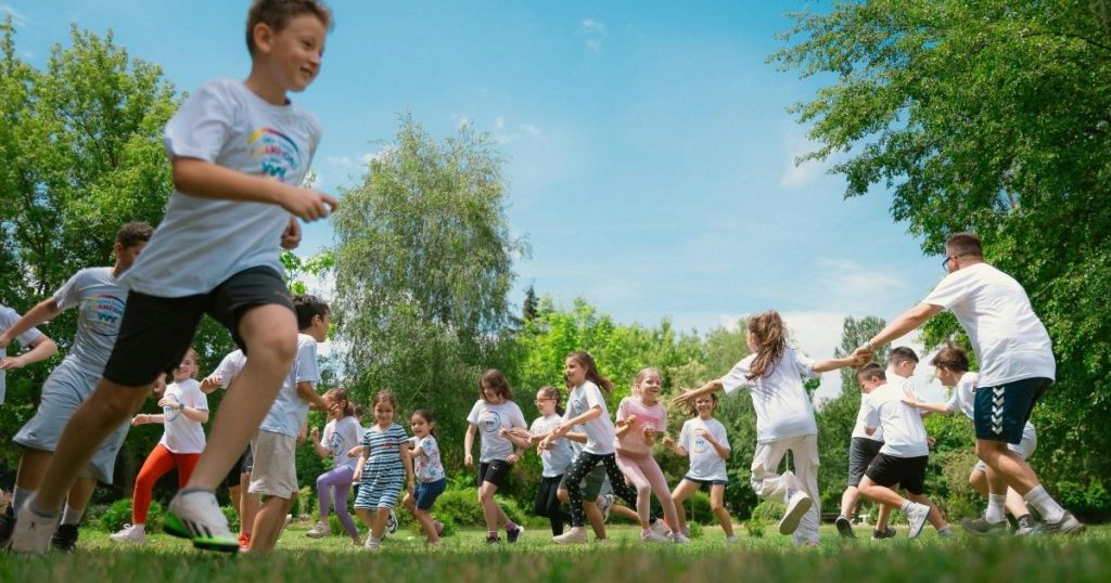 Children participating in team sports, promoting physical activity, health, and prevention from an early age.