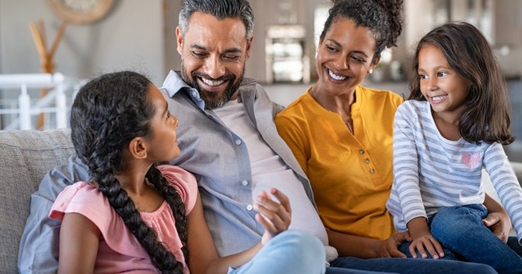 Happy family spending time together, highlighting how obesity affects entire households and future generations.