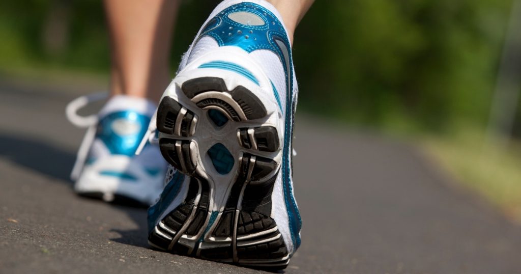 Feet walking forward, symbolizing small daily steps toward better health and long-term change.